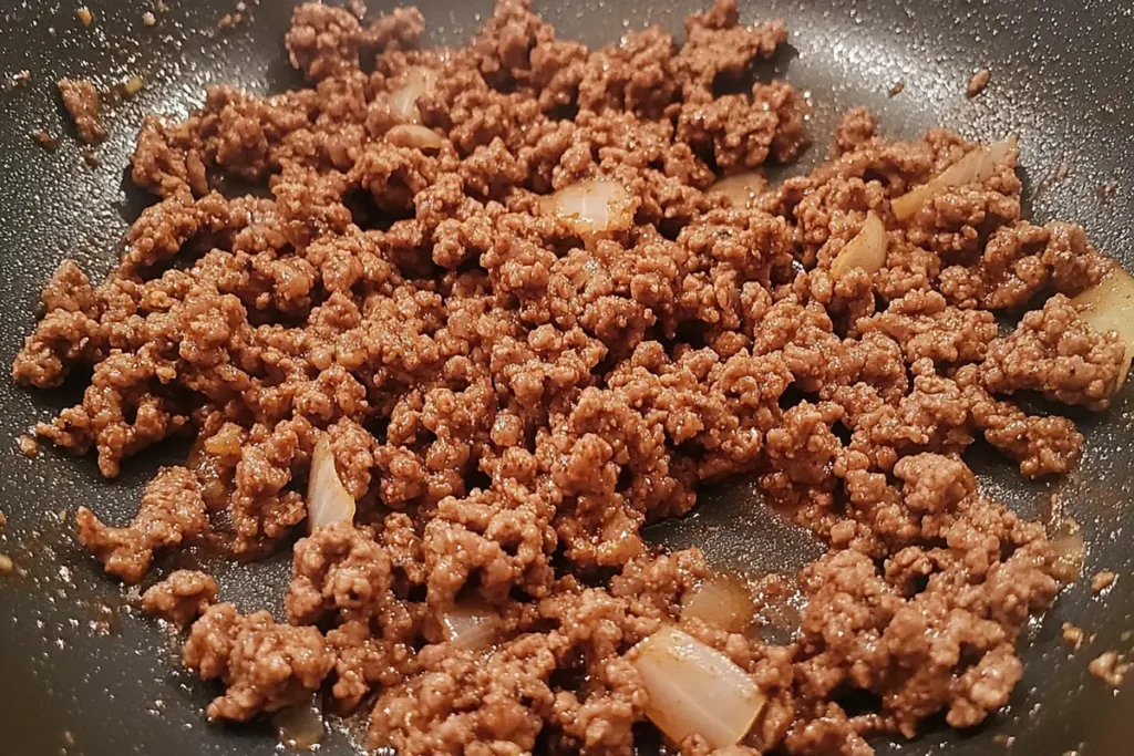 Properly browned ground beef in a skillet, perfect texture for many delicious ground beef recipes.